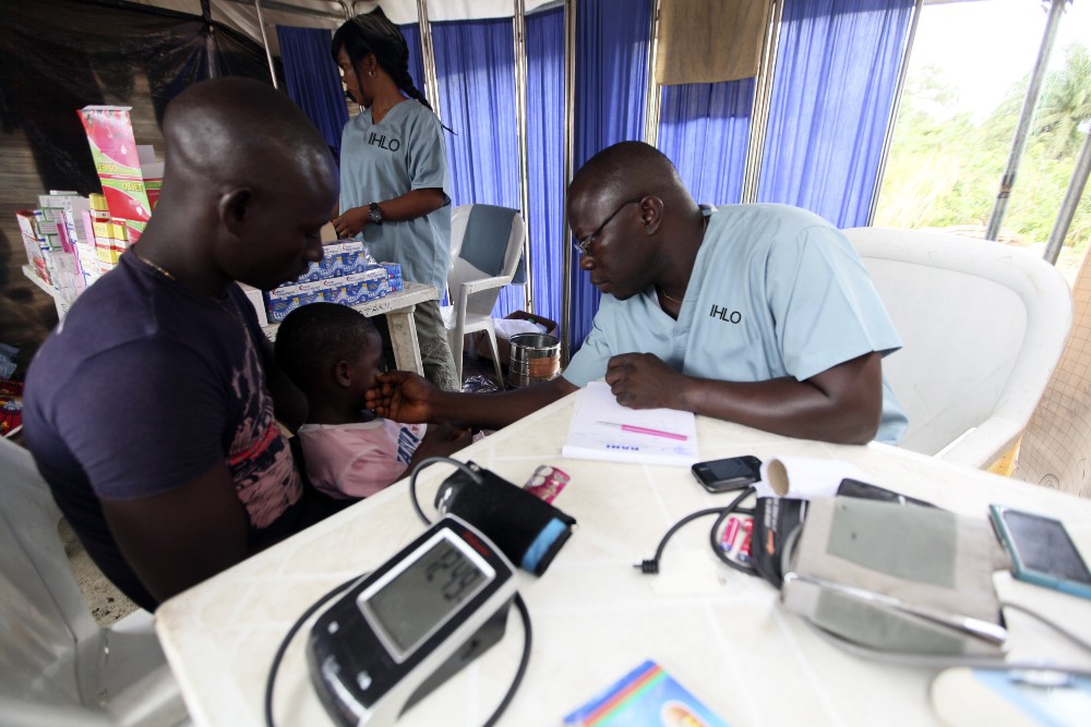 Image of checking child at the time of campaigns by IHLO in AFRICA 